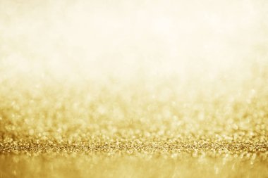 Soyut altın parıltısı arkaplan ile bulanıklaştırılmış