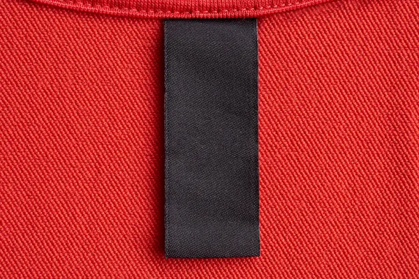 Etiqueta Roupas Cuidado Lavandaria Preta Branco Fundo Textura Tecido Vermelho — Fotografia de Stock