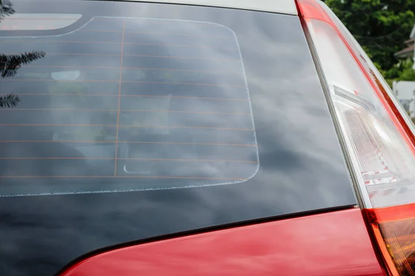 Back view of red car window for sticker mockup