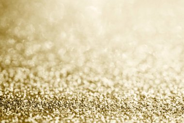 Soyut altın parıltısı arkaplan ile bulanıklaştırılmış