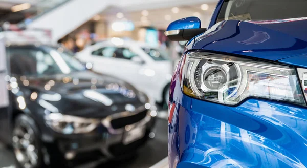 new cars in dealer showroom interior background