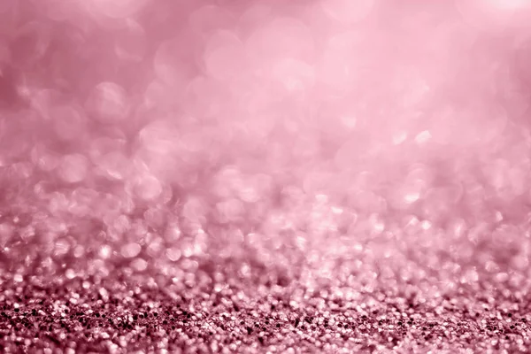 Abstract rose gold glitter sparkle texture with bokeh background