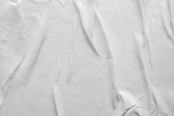 Blank white crumpled and creased paper poster texture background