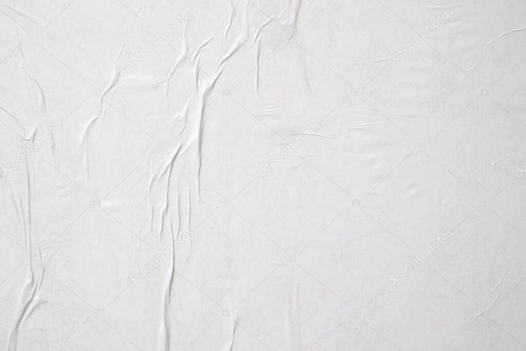 Blank white crumpled and creased paper poster texture background