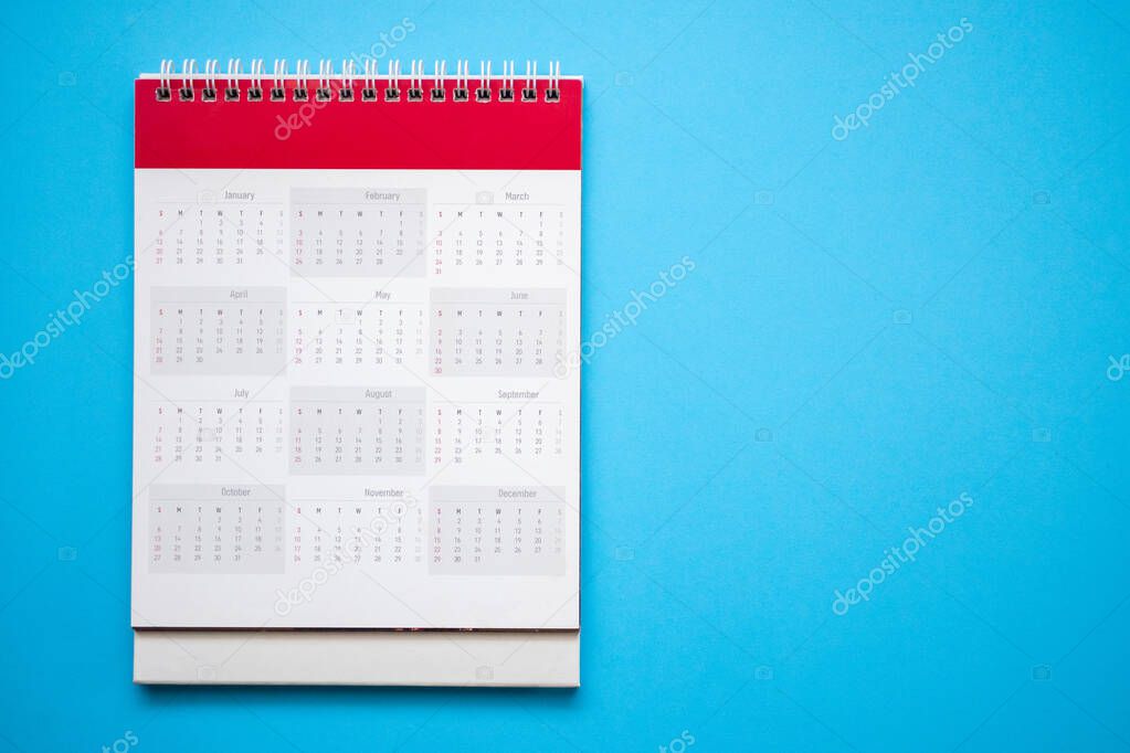 calendar page on blue background business planning appointment meeting concept