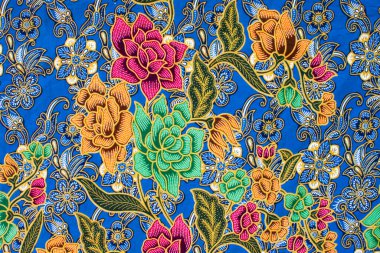 Dişilerin sarong deseni Malezya, Endonezya ve Tayland 'da güzel ve renkli bir sanattır. Sarong desenli sanat çiçekleri ve Asya 'daki kadınlar için moda. Fotoğrafı kapat, manzara arkaplanı