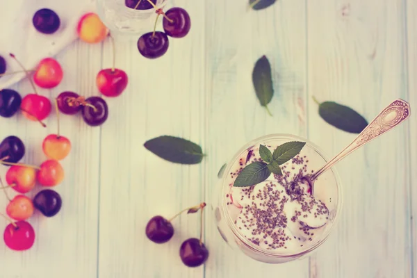 Dessert with cherry, yogurt, corn flakes — Stock Photo, Image