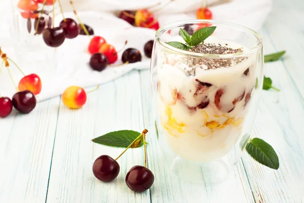 Dessert with cherry, yogurt, corn flakes — Stock Photo, Image
