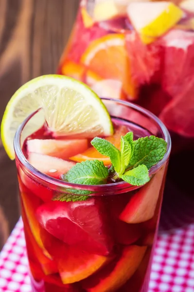 Refreshing summer drink with lots of different fruits — Stock Photo, Image