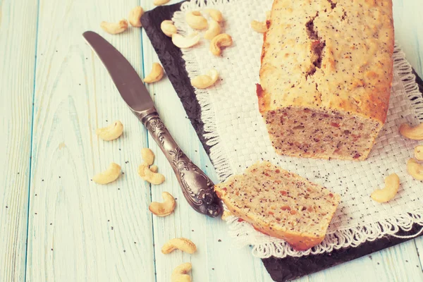 Homemade banana and nuts bread on a wooden table — Stock Photo, Image