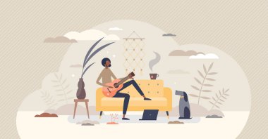 Gitar akorlarını ve sekmelerini alıştırma veya ders olarak öğrenmek küçük insan konsepti