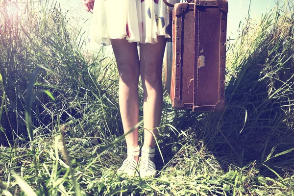 vintage woman ready to leave for a trip around the world