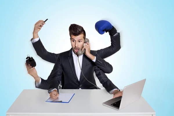 Multitasking business man with six arms — Stock Photo, Image