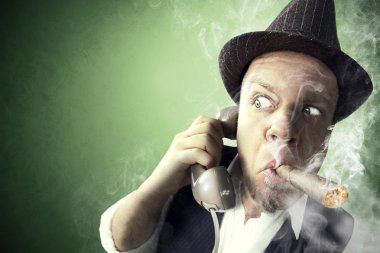 Nervous Investigator having an important phone call while smoking clipart