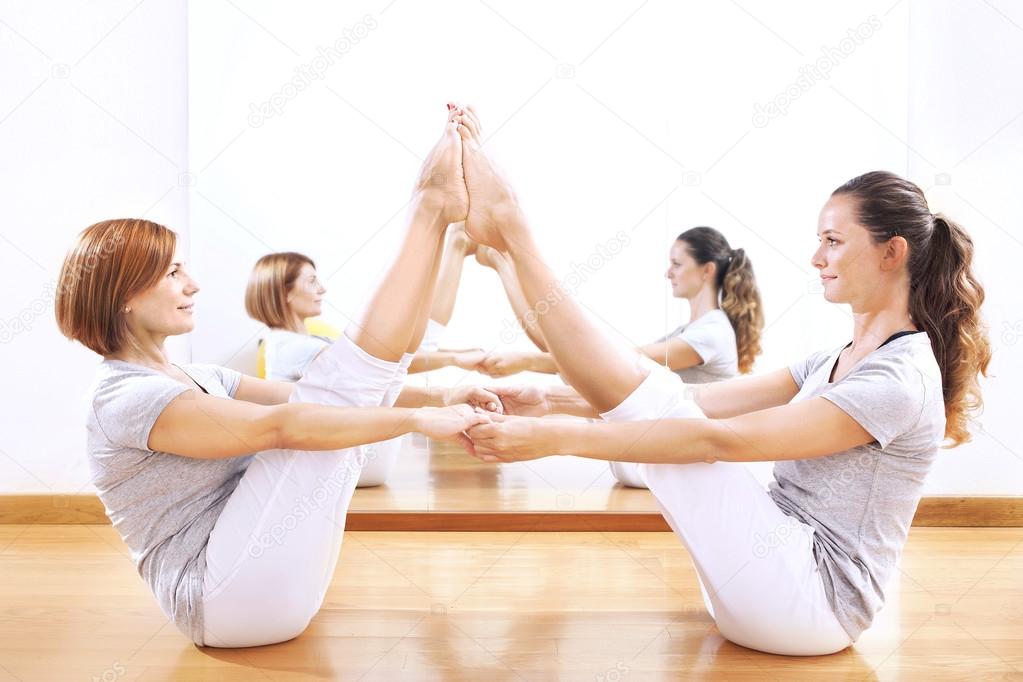 women finding body balance throw a phisical exercise