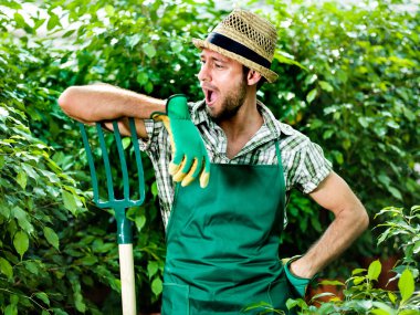 Funny farmer jokes with his pitchfork clipart