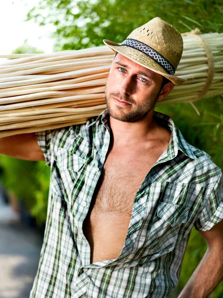 Farmer at work in a greenhouse — Stock Photo, Image