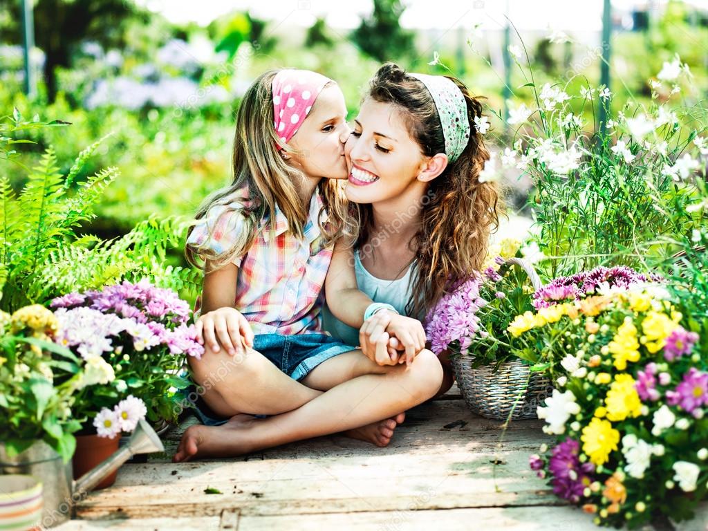 Mom and daughter have fun in the work of gardening