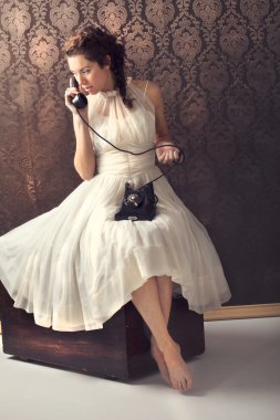 Beautifull young woman on the phone clipart