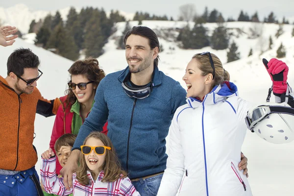 Two families with children walking in the snow — Stock Photo, Image