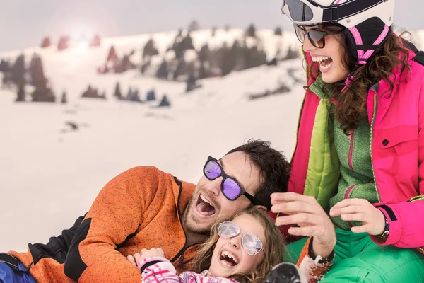 Family having fun in the snow — Stock Photo, Image