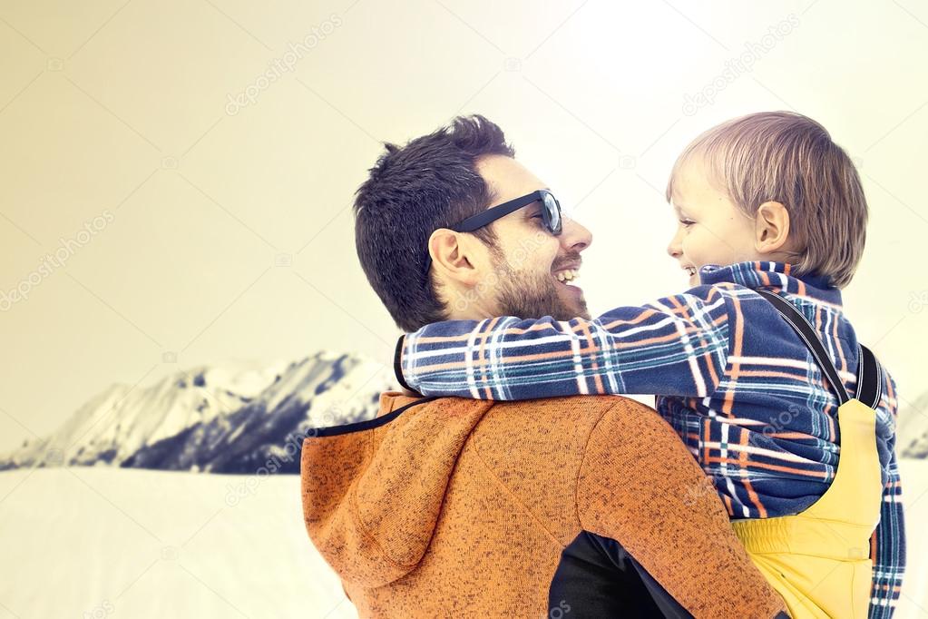 Father carring his son to wanderfull winter landscapes