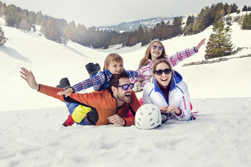 happy family having fun in the snow