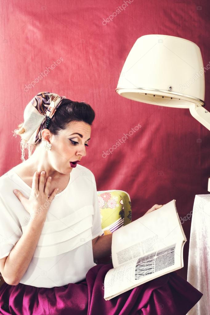 vintage housewife reads magazine in in Beauty salon