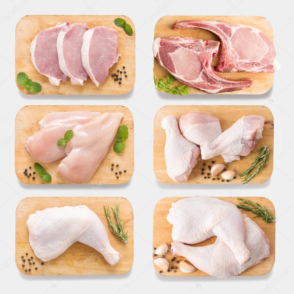 Mockup raw chicken and pork on cutting board set on isolated on Stock Photo by ©villagemoon