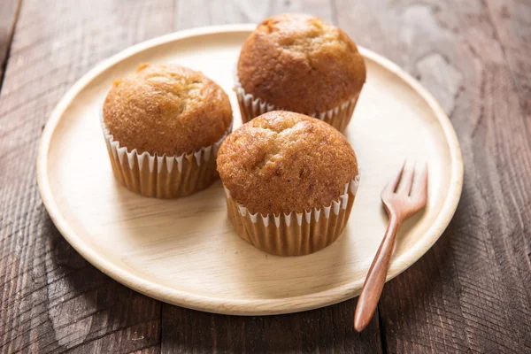 Muffins on a wooden table — Stock Photo, Image