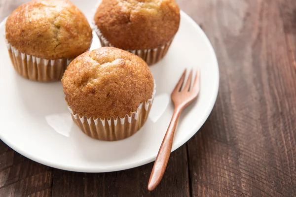 Muffins on a wooden table — Stock Photo, Image