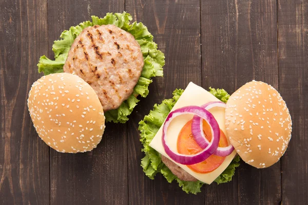 Bbq hamburger on the wooden background — Stock Photo, Image