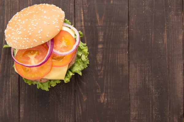 Top view bbq hamburger on the wooden background. — Stock Photo, Image
