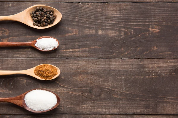 Collection set of spices on wooden spoons. — Stock Photo, Image