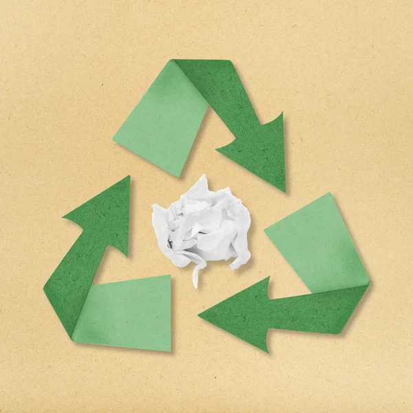 recycle crumpled paper recycling symbol on paper background.