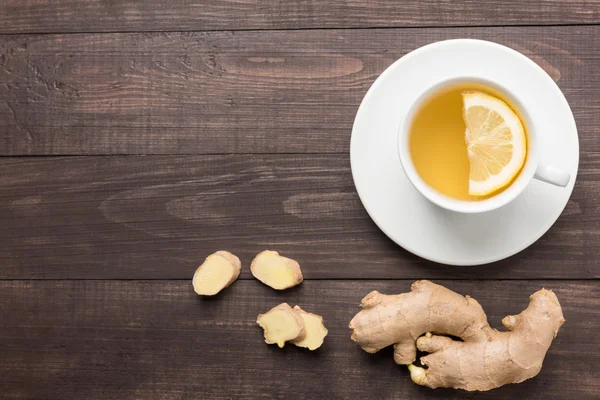 Ginger tea with lemon on the wooden background — Stock Photo, Image
