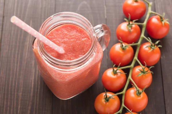 Healthy vegetable. Glass of red tomato juice on wooden table — Stock Photo, Image