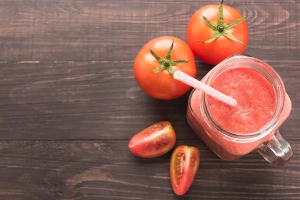 Healthy vegetable. Glass of red tomato juice on wooden table — Stock Photo, Image