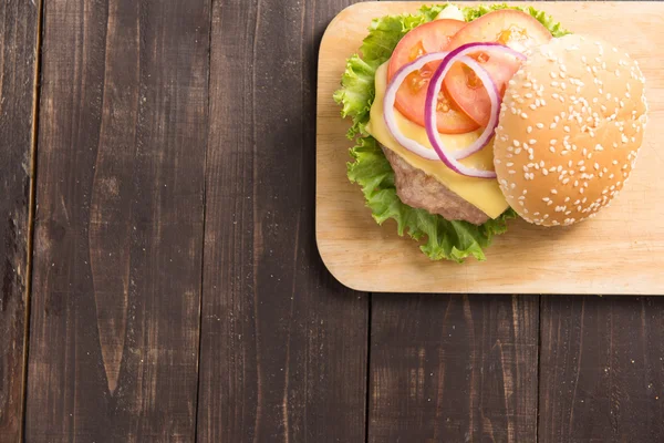 Top view bbq hamburger on the wooden background — Stock Photo, Image