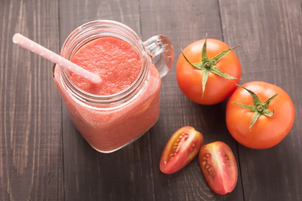 Healthy vegetable. Glass of red tomato juice on wooden table — Stock Photo, Image