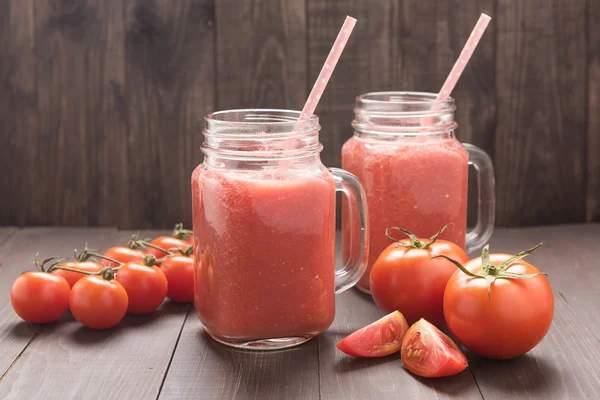 Healthy vegetable. Glass of red tomato juice on wooden table — Stock Photo, Image