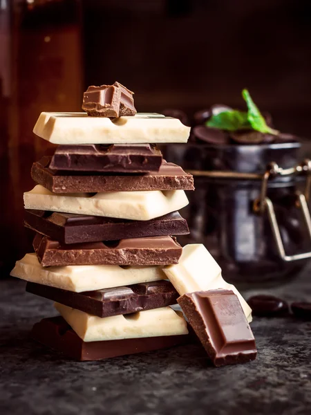 Chocolate tower on dark stone background.