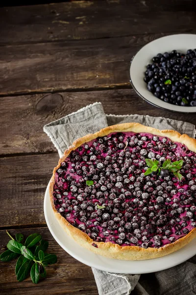 Homemade pie with bilberry  on dark wooden table — Stock Photo, Image