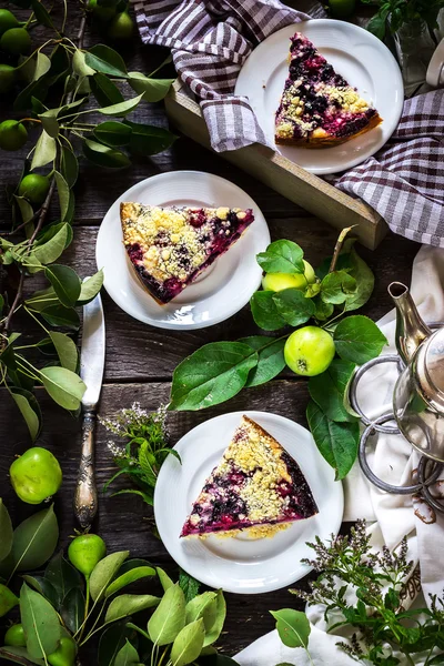 Slices of blueberry pie on dark wooden background. — Stock Photo, Image