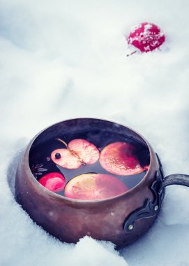 Vintage copper ladle with hot mulled wine. clipart