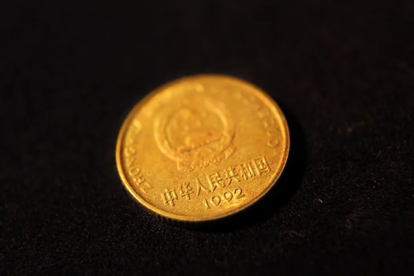 Golden coin from China — Stock Photo, Image