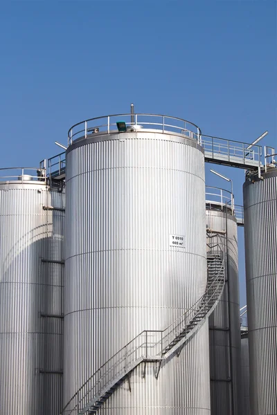 Tall metal storage tanks — Stock Photo, Image