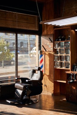 Interior of barbershop with professional barber chair clipart