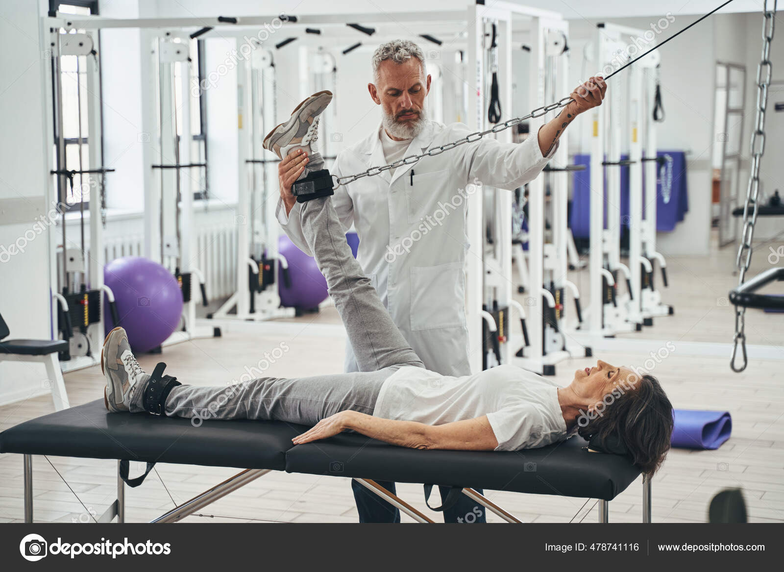 Patient doing a strength training exercise using a cable machine