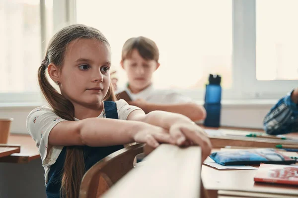 Calm child waiting for the lesson to begin — Stock Photo, Image